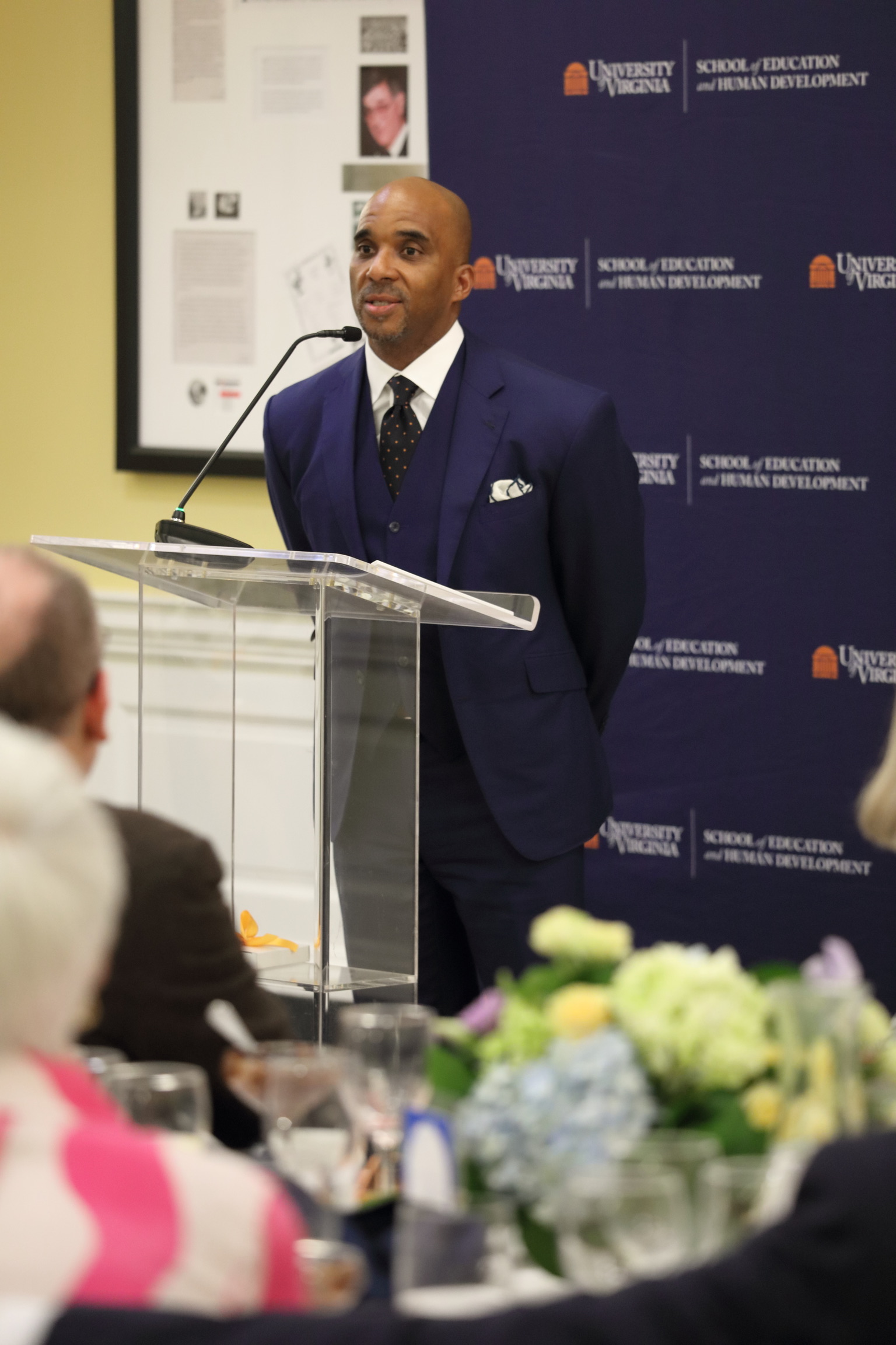 Dr. Luvelle Brown speaking at a lectern